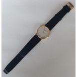 A gent's 18 carat gold Longines slim wristwatch on