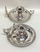 A pair of silver plated chamber sticks and extingu