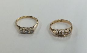 Two 18 carat gold diamond set rings. Approx. 4.5 g