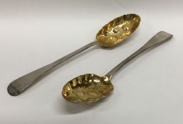 A boxed pair of silver berry spoons with gilt bowl