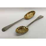 A boxed pair of silver berry spoons with gilt bowl