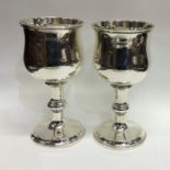 A good pair of Georgian silver goblets with reeded