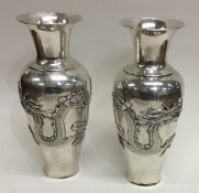 A good pair of tall Chinese silver baluster shaped