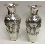 A good pair of tall Chinese silver baluster shaped