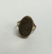 A 9 carat hinged top ring engraved with scrolls. A
