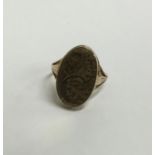 A 9 carat hinged top ring engraved with scrolls. A