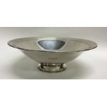 A heavy tapering silver fruit bowl with engine tur