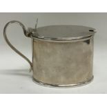 A good Georgian oval silver mustard pot. London. B