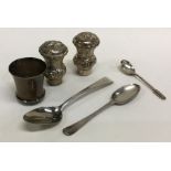 A bag containing silver stoppers, teaspoons etc. A