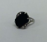 A good Art Deco onyx and diamond ring in white gol