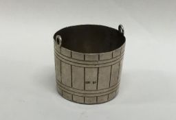 A Russian silver strainer in the form of a bucket.