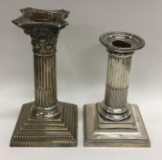 A Corinthian column silver candlestick together wi