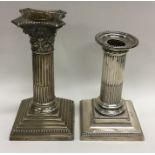 A Corinthian column silver candlestick together wi