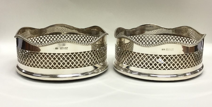 A good pair of silver wine coasters with gadroon r