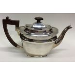 A good heavy Edwardian silver teapot with gadroon
