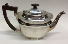 A good heavy Edwardian silver teapot with gadroon