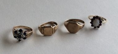 A group of four 9 carat gem set rings. Approx. 11.