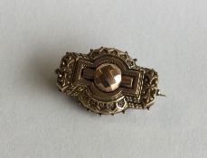 A Victorian 9 carat gold bar brooch with ball deco