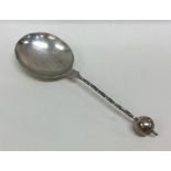 An unusual silver presentation spoon with twisted