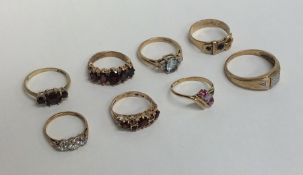 Eight 9 carat gem set rings. Approx. 19 grams. Est