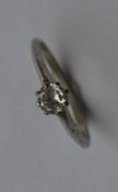 An Antique platinum and diamond single stone ring