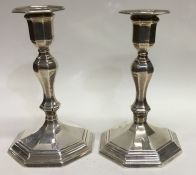 A pair of Edwardian silver candlesticks of octagon