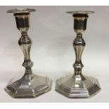 A pair of Edwardian silver candlesticks of octagon