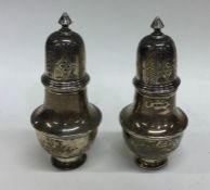 A pair of silver peppers of baluster form. Birming
