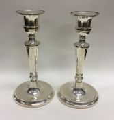 A pair of modern circular silver candlesticks. Lon