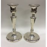 A pair of modern circular silver candlesticks. Lon