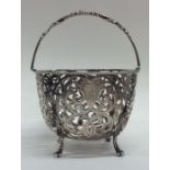 A Victorian silver pierced sugar bowl with scroll