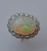 A large opal cluster ring, the central stone being