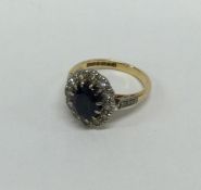 A good 18 carat sapphire and diamond cluster ring