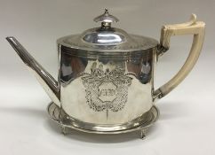 A good Georgian silver teapot on stand with attrac