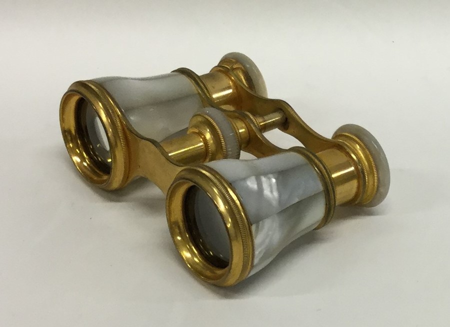 A good pair of gilt and MOP opera glasses in leath