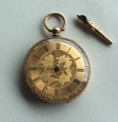 An 18 carat Swiss fob watch together with a key. A