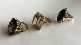 A group of three 9 carat single stone rings. Appro