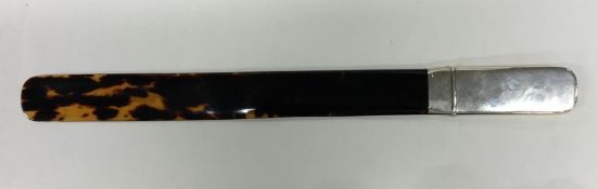 A silver and tortoiseshell paper knife. Approx. 37