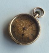 A lady's 14 carat fob watch with engraved decorati