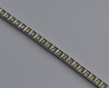 A heavy French diamond line bracelet with articula
