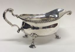 A massive Georgian style silver sauce boat with ga