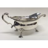 A massive Georgian style silver sauce boat with ga