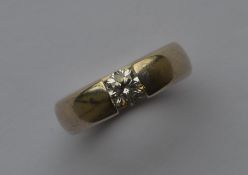 A good diamond gent's single stone ring of domed f
