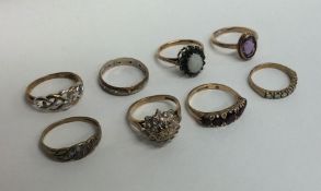 Eight 9 carat gem set rings. Approx. 19 grams. Est