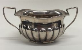 An Edwardian silver sugar bowl with wavy edge. Che