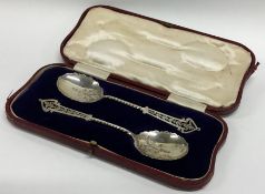 A boxed pair of silver preserve spoons with pierce