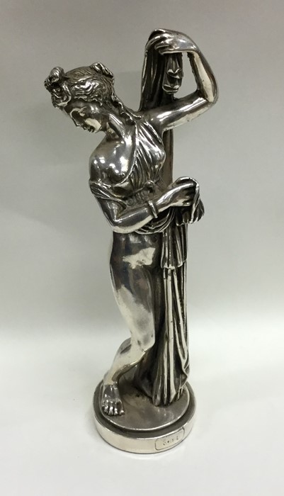 A Continental silver figure of a semi-naked lady.