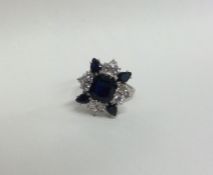 A massive sapphire and diamond cluster ring, the l