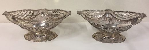 A good pair of Georgian silver fruit baskets attra