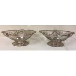 A good pair of Georgian silver fruit baskets attra